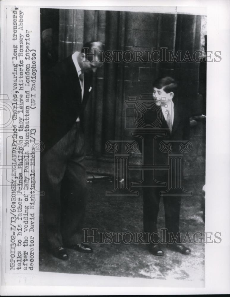 1960 Press Photo Prince Charles wearing long trousers, talks to his father - Historic Images