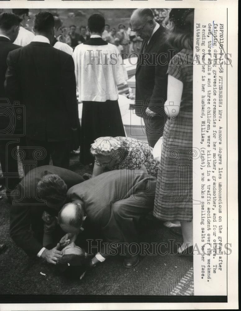 1958 Press Photo Mrs. Annor Rogers fainted during graveside ceremony. - Historic Images