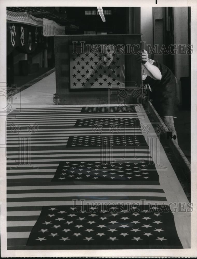 1970 Press Photo Woman checking silk screen of stars of U.S. flag - Historic Images