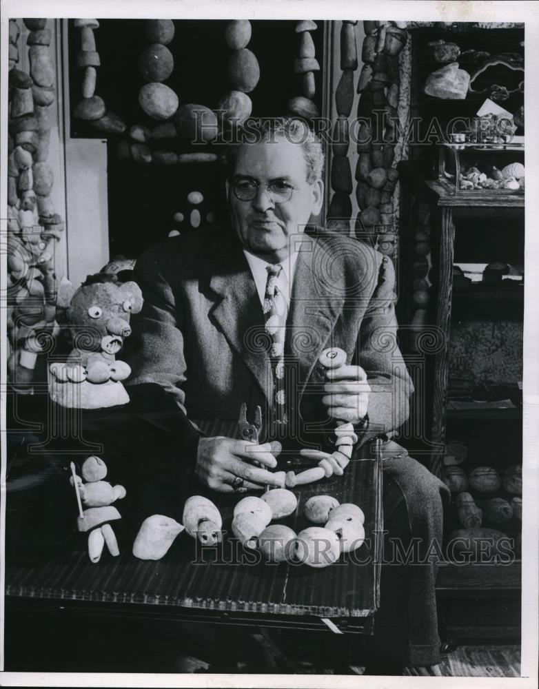 1952 Press Photo George L. Coban shows part of his collection of stones. - Historic Images