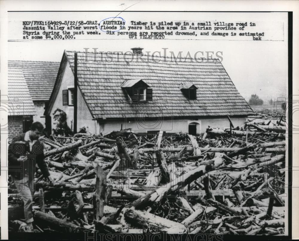 1958 Press Photo Timber is collected for small village after flood - Historic Images