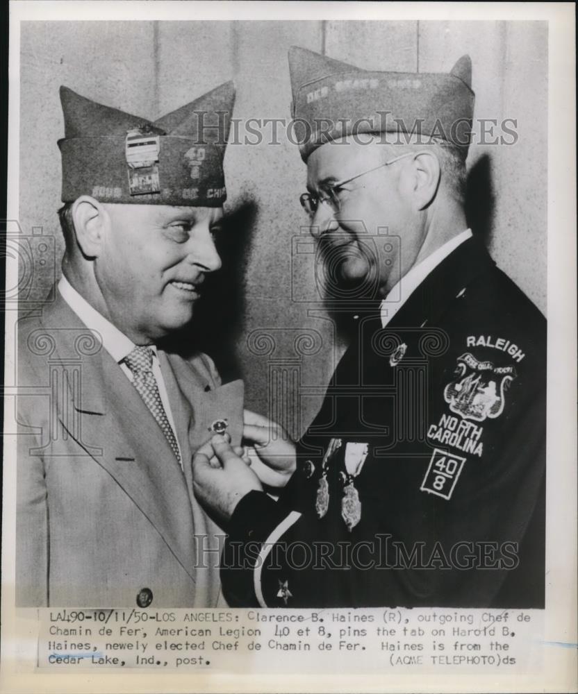 1950 Press Photo Clarence B. Haines pins the tab on Harold B. Haines - Historic Images