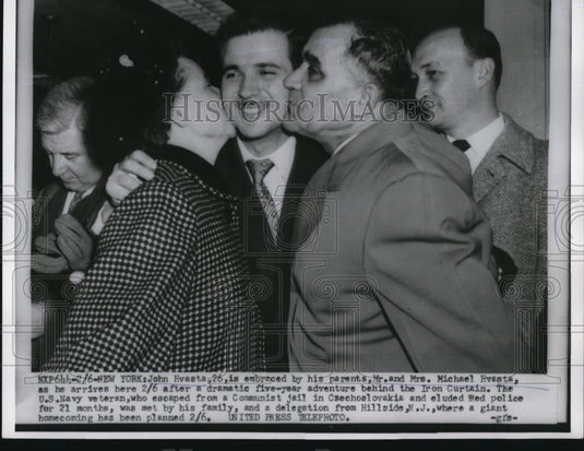 1954 Press Photo New York John Hvasta is embraced by his parents Mr & Mrs Michae - Historic Images
