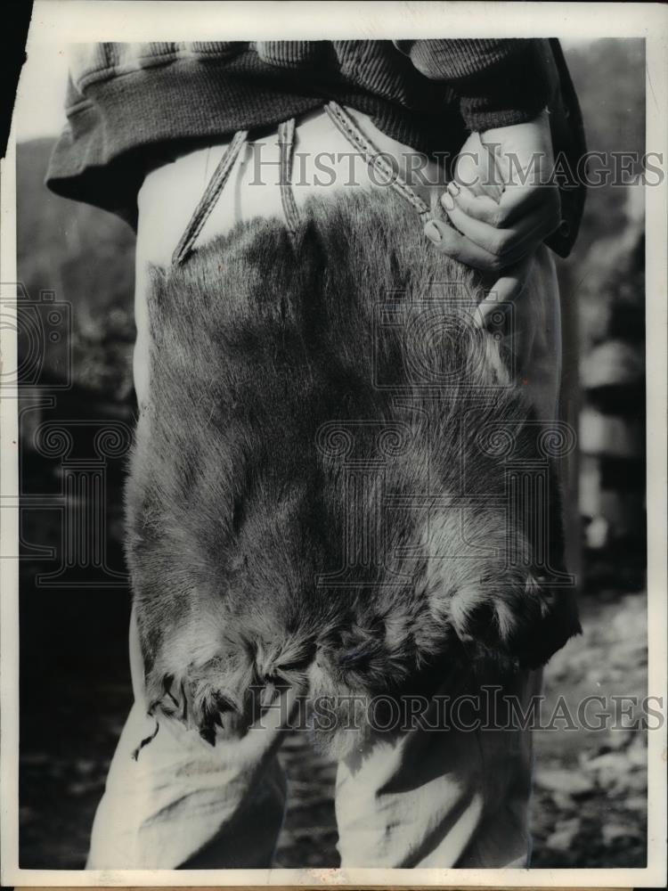 1958 Press Photo Fur Bustles the Lumberjacks of Taiwan dangling from waist. - Historic Images