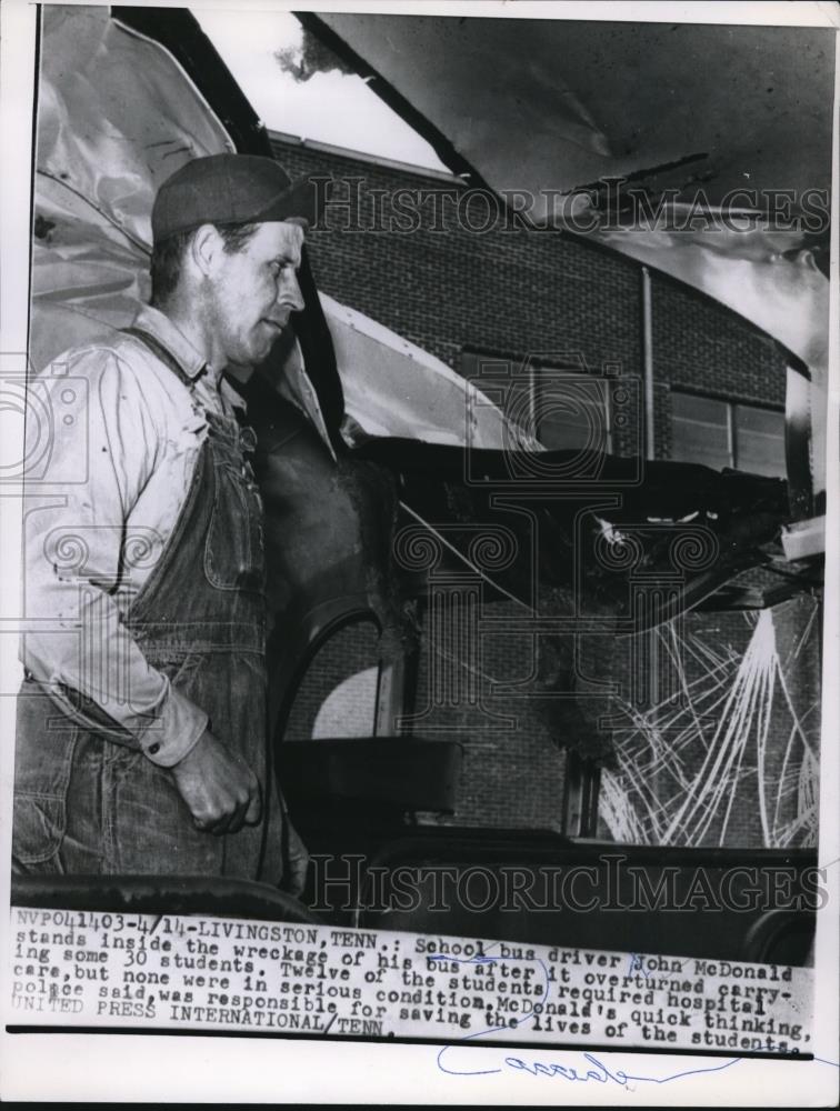 1959 Press Photo School Bus driver John McDonald stands inside his wrecked bus - Historic Images