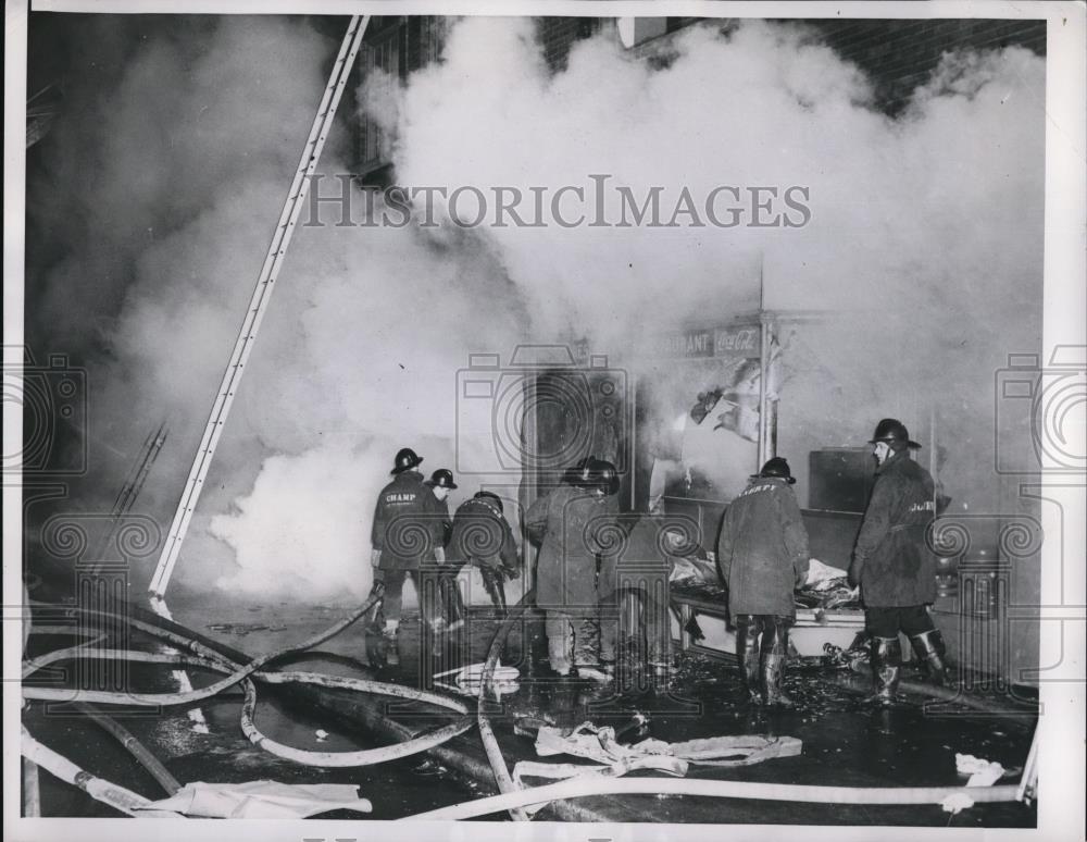 1955 Press Photo Gary Ind, firemen battle blaze at Kostur Hotel - Historic Images