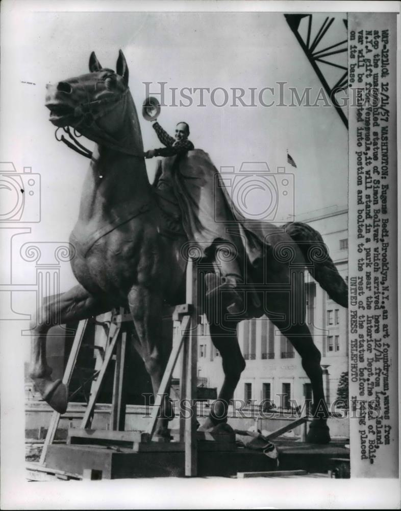 1957 Press Photo Washington Eugene Bedi an art foundryman waves from atop - Historic Images