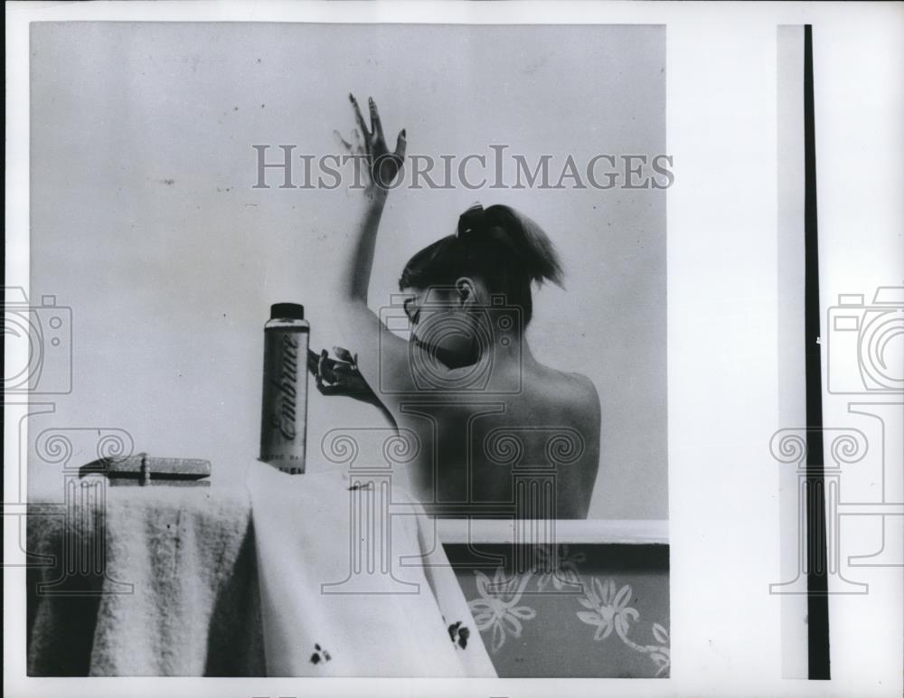 1956 Press Photo Lady Using Bath Oil to Treat Dry Skin in the Bath - Historic Images