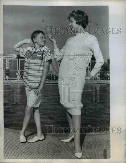 1959 Press Photo A modeling gesture, a young lad matches stances w/ pretty girl - Historic Images