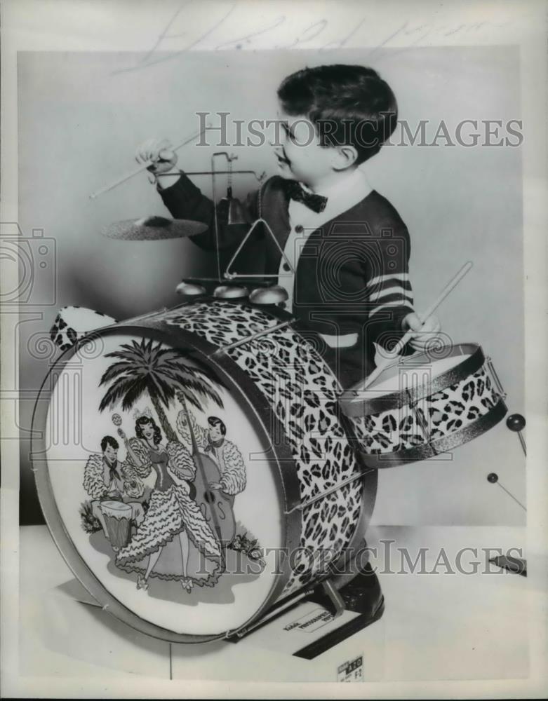 1957 Press Photo Little boy plays a drum - Historic Images