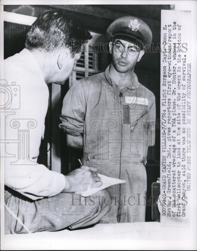 1956 Press Photo Flight Surgeon Capt. Donn R. Hunter, Greenfield, Ind., gives - Historic Images