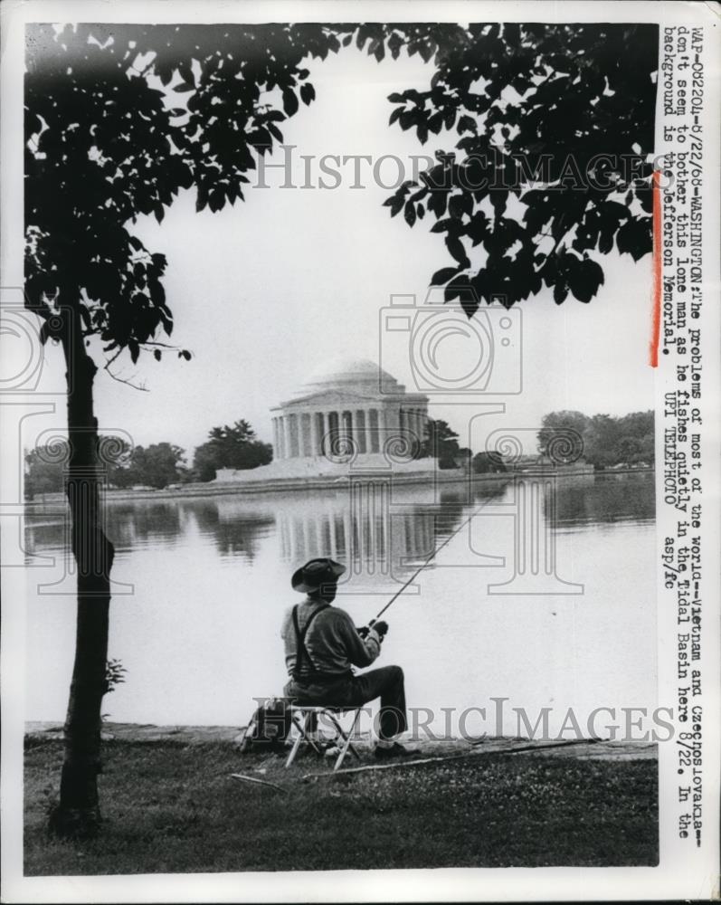 1968 Press Photo Lone man fishes in Tidal Basin near Jefferson Memorial - Historic Images