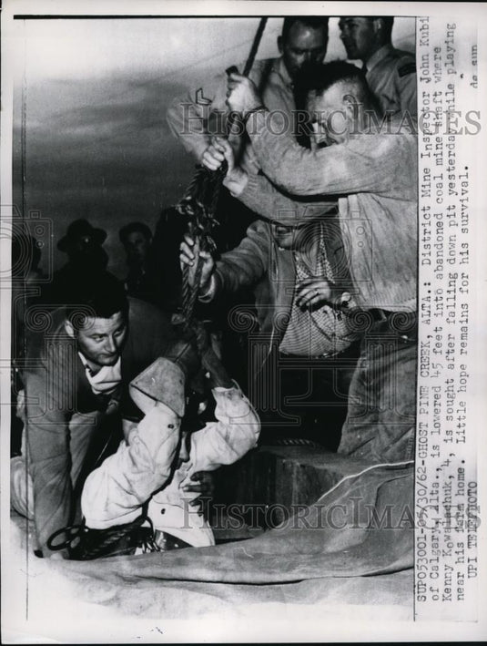 1962 Press Photo of district mine inspector John Kubi being lowered into a mine. - Historic Images