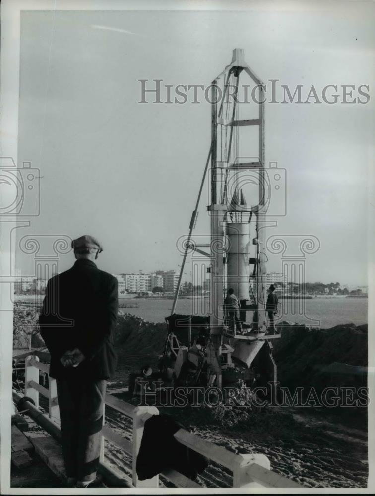 1961 Press Photo Man observes missile on its launch pad in Cannes, France - Historic Images