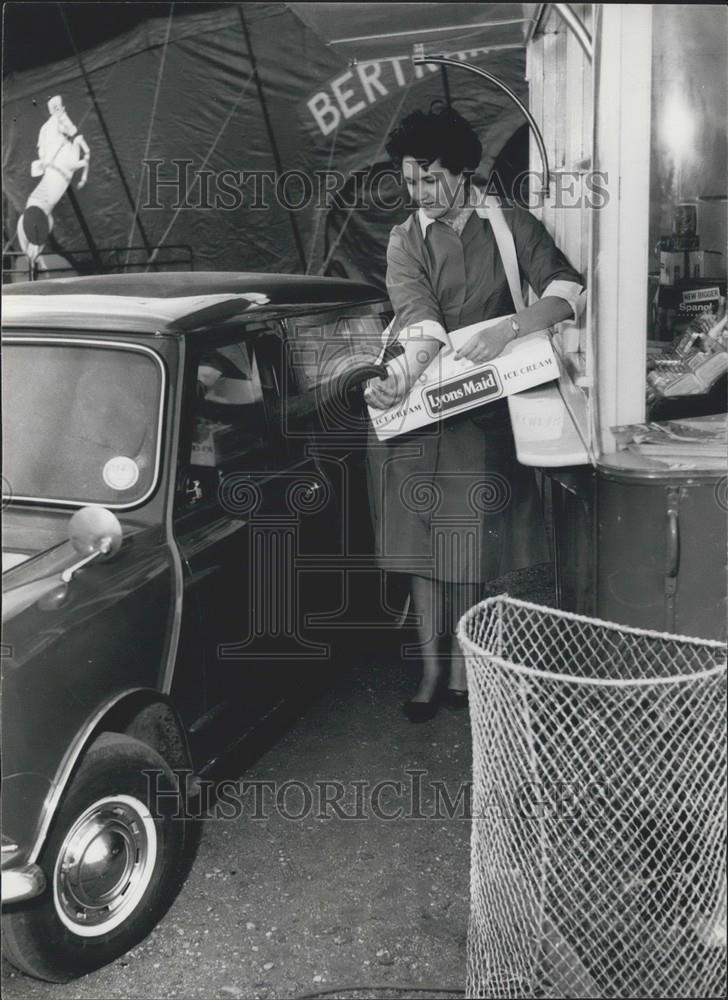 1964 Press Photo Baby Elephant In Car Tries To Get Ice Cream From Woman - Historic Images