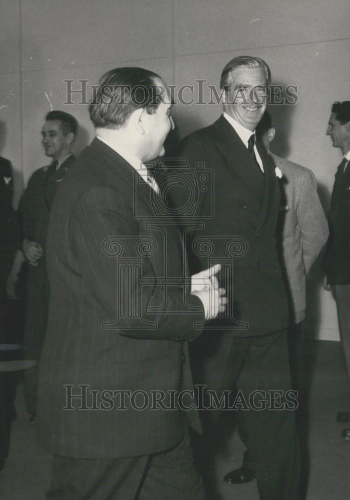 Press Photo Sir Anthony Eden smiles brightly as he walks with Mr. France. - Historic Images