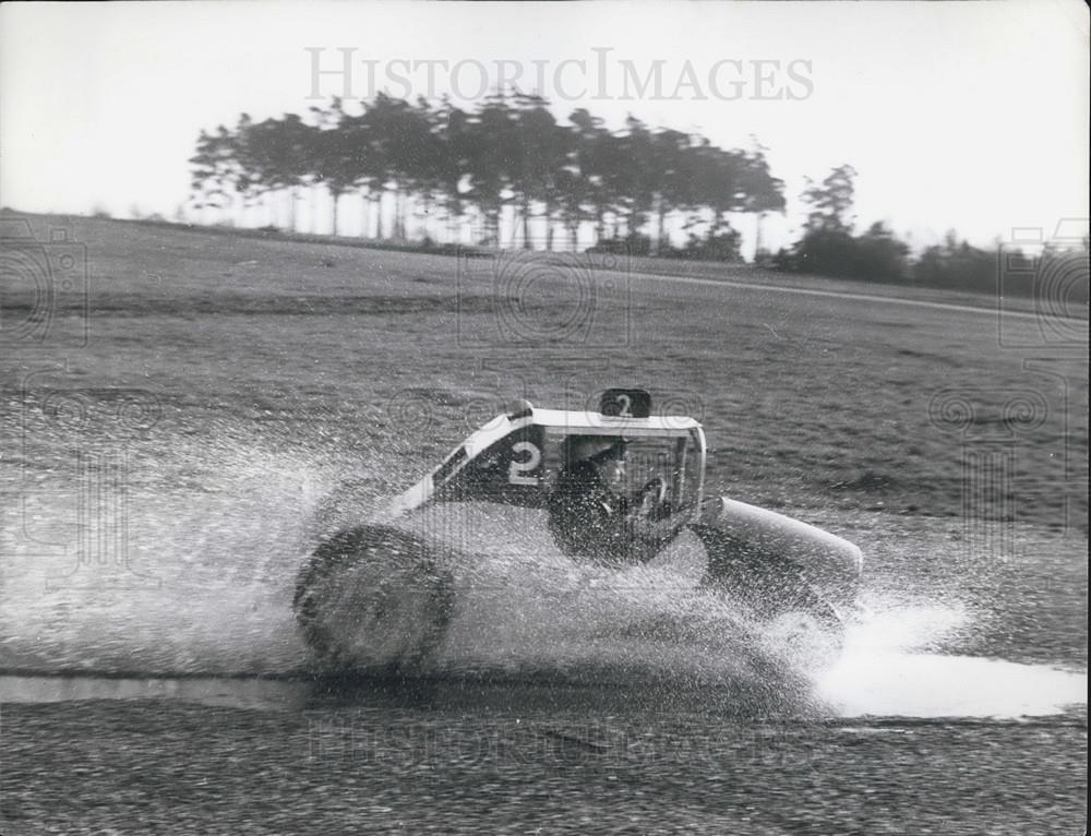 Press Photo 5 yr Old Stock Car Driver Splashing In Puddles With Car - Historic Images