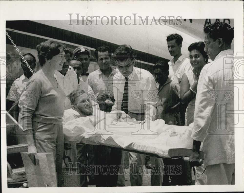 1961 Press Photo Peter Mulgrew Arriving On A Stretcher @ Dun Dun Airport - Historic Images