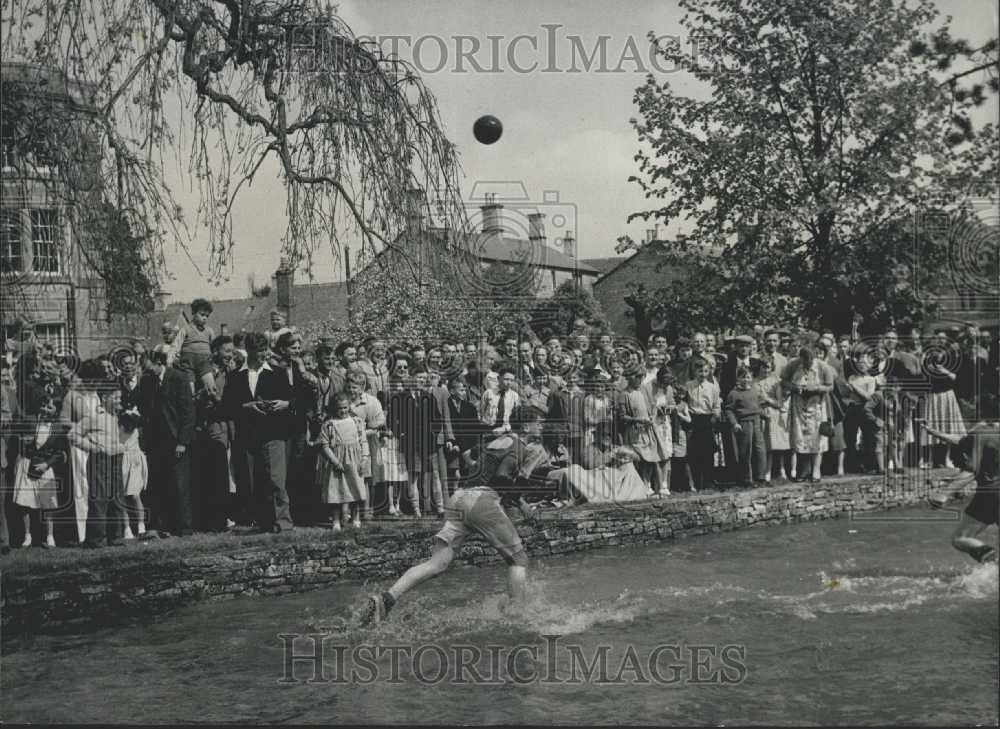 Press Photo Men Playing ball Inside River - Historic Images