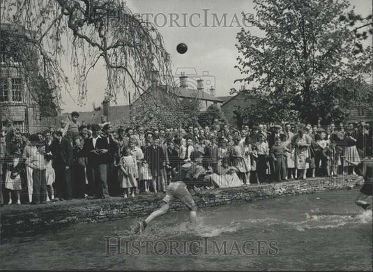 Press Photo Men Playing ball Inside River - Historic Images