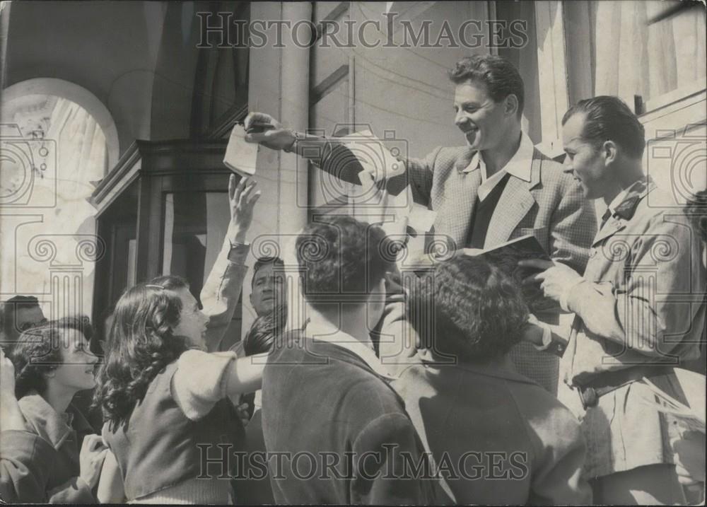 1954 Press Photo Jean-Pierre Aumon French Actor Signs Autographs Cannes Festival - Historic Images