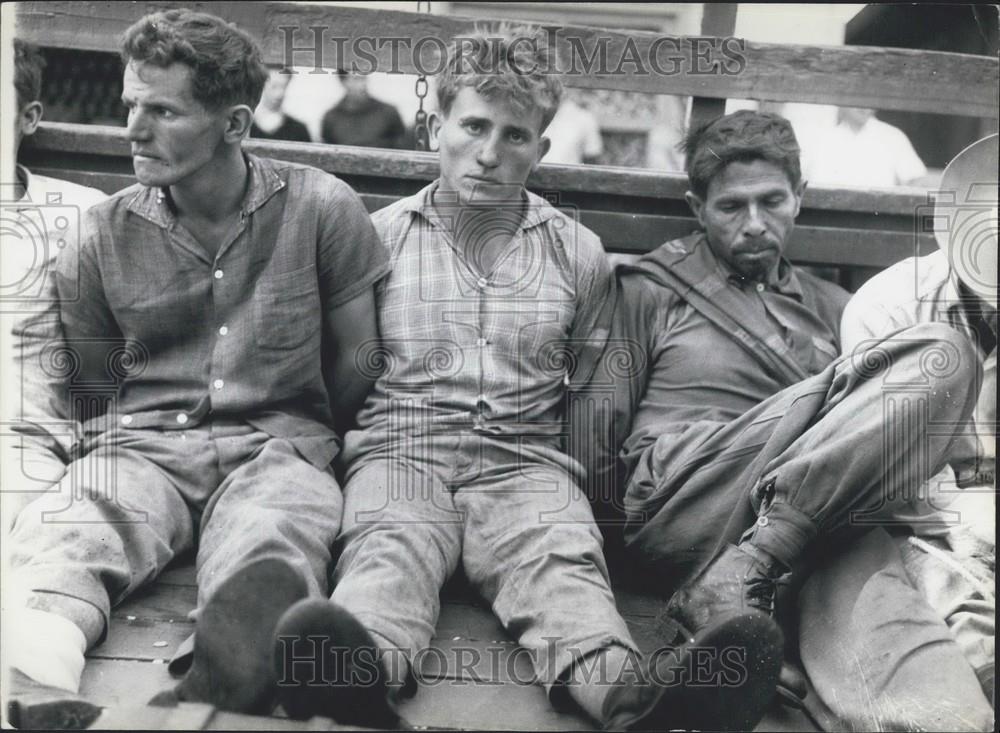 Press Photo Guerrillas In Jail Sitting On Floor Handcuffed - Historic Images