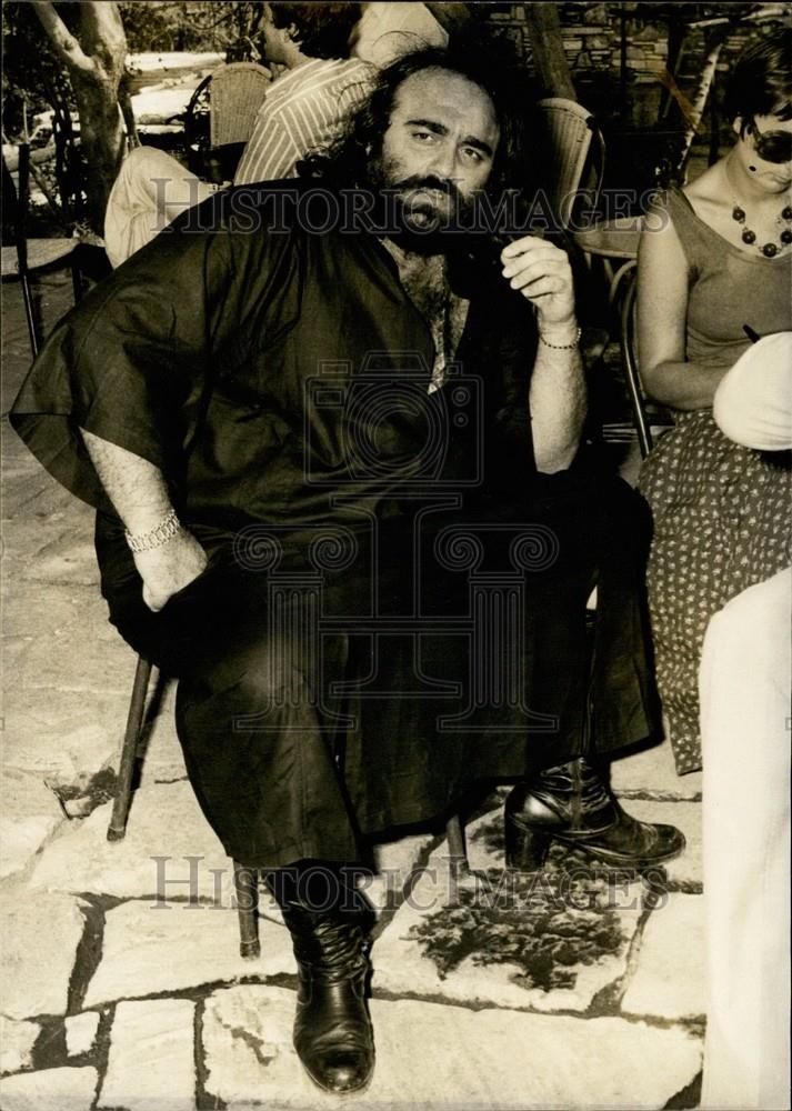 Press Photo Greek Singer Dehis Roussos Seated - Historic Images