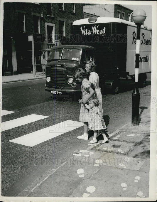 Press Photo Footprints on the Roadway - Historic Images