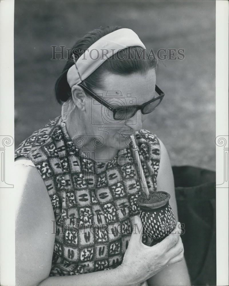 Press Photo Woman Drinking Mate Herb Tea From Gourd Uruguay - Historic Images