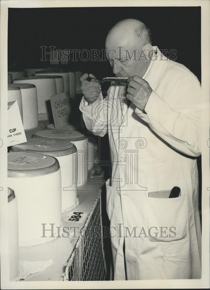 1957 Press Photo Sampling of cheese for quality &amp; health control - Historic Images