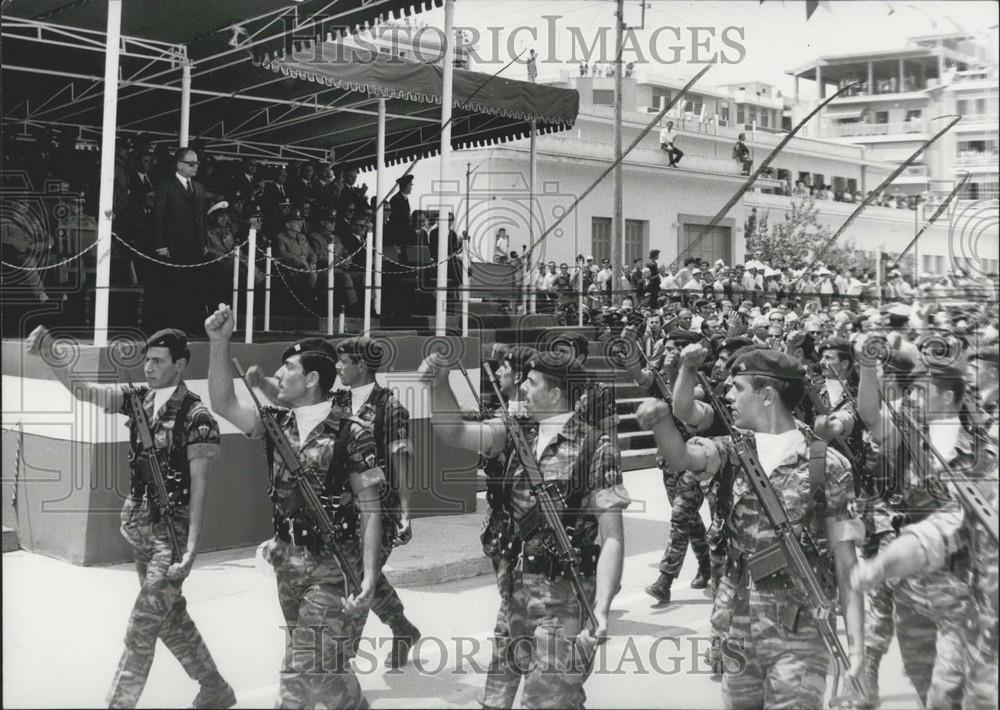 Press Photo military men marching with guns - Historic Images