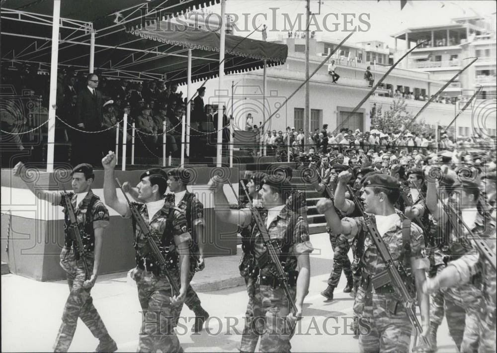 Press Photo military men marching with guns - Historic Images