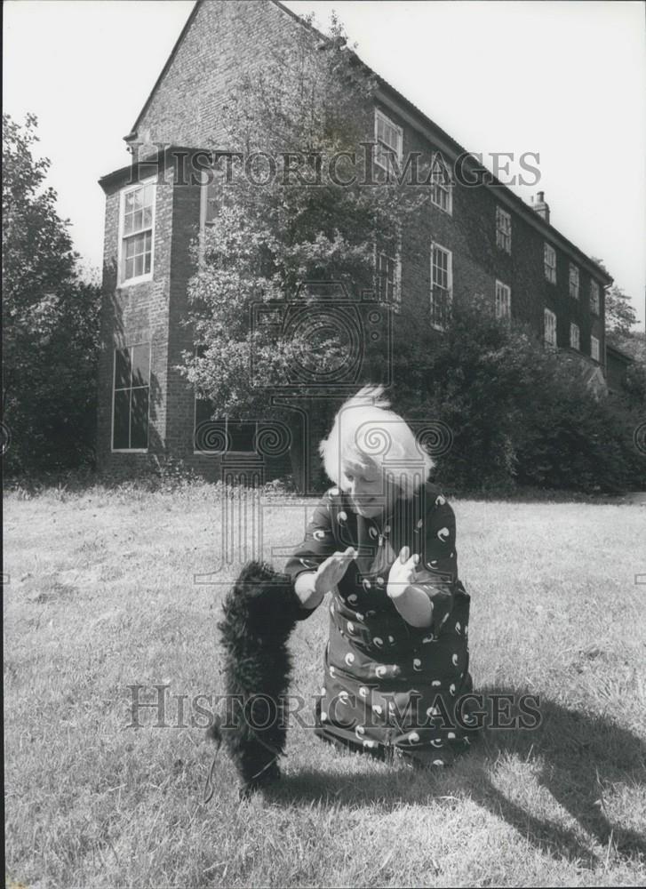 Press Photo Miss Wagner playing with her pet poodle at the Vicarage, at Norton - Historic Images