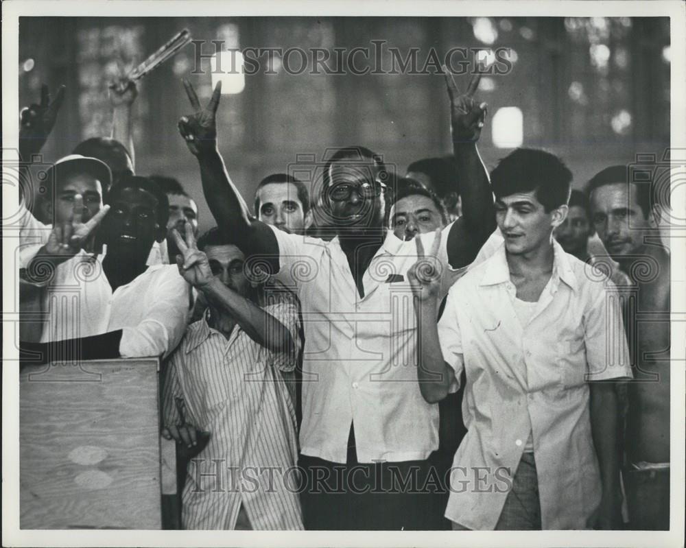 Press Photo Cuban Refugees Waving at Gate of Opa Locka - Historic Images