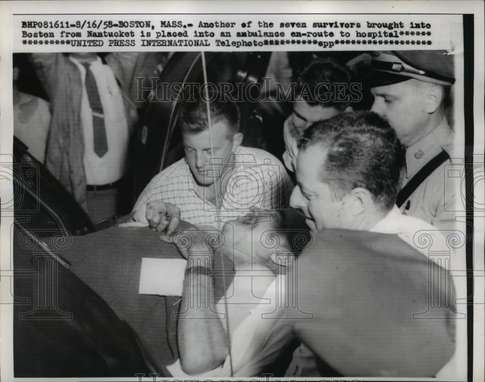 1958 Press Photo A survivor from Nantucket is placed into the ambulance. - Historic Images