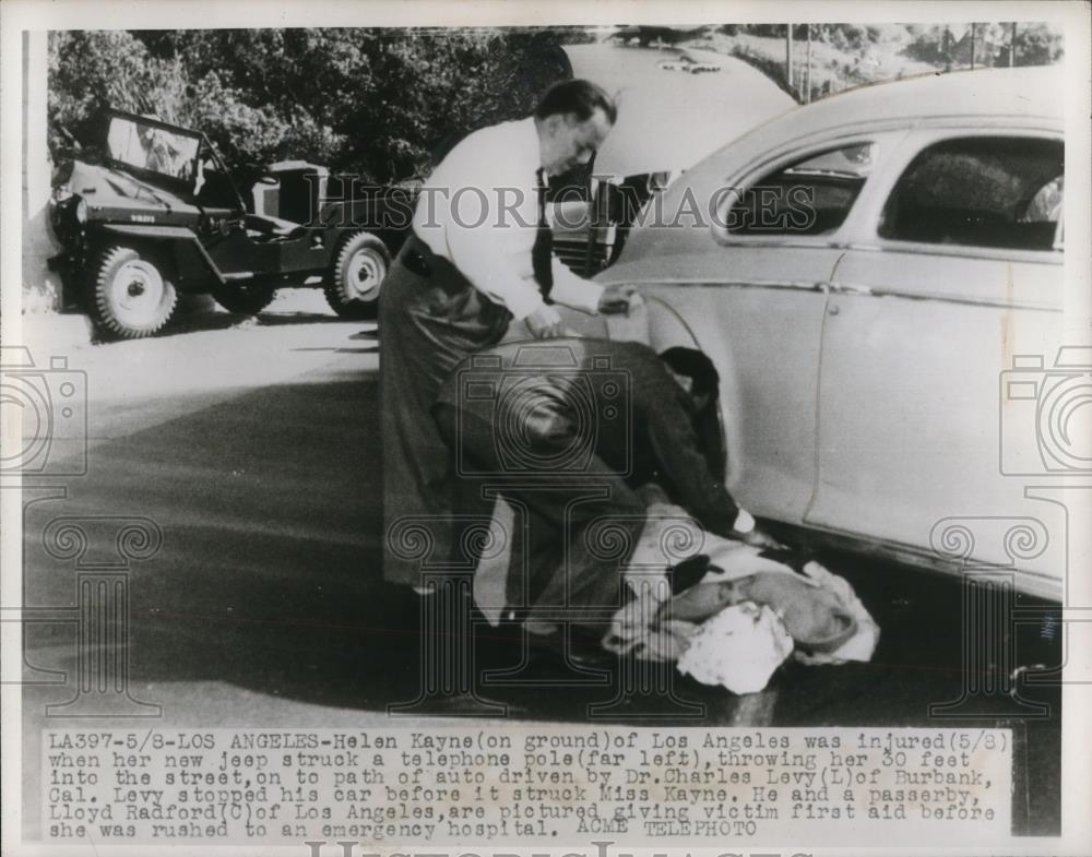 1947 Press Photo Dr.Charles Levy and Lloyd Radford helping Helen Hayne - Historic Images