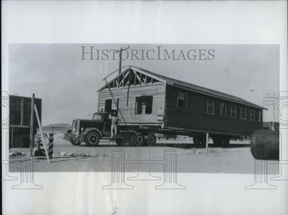 1950 Press Photo Community Hall being trucked from a surplus sale - Historic Images