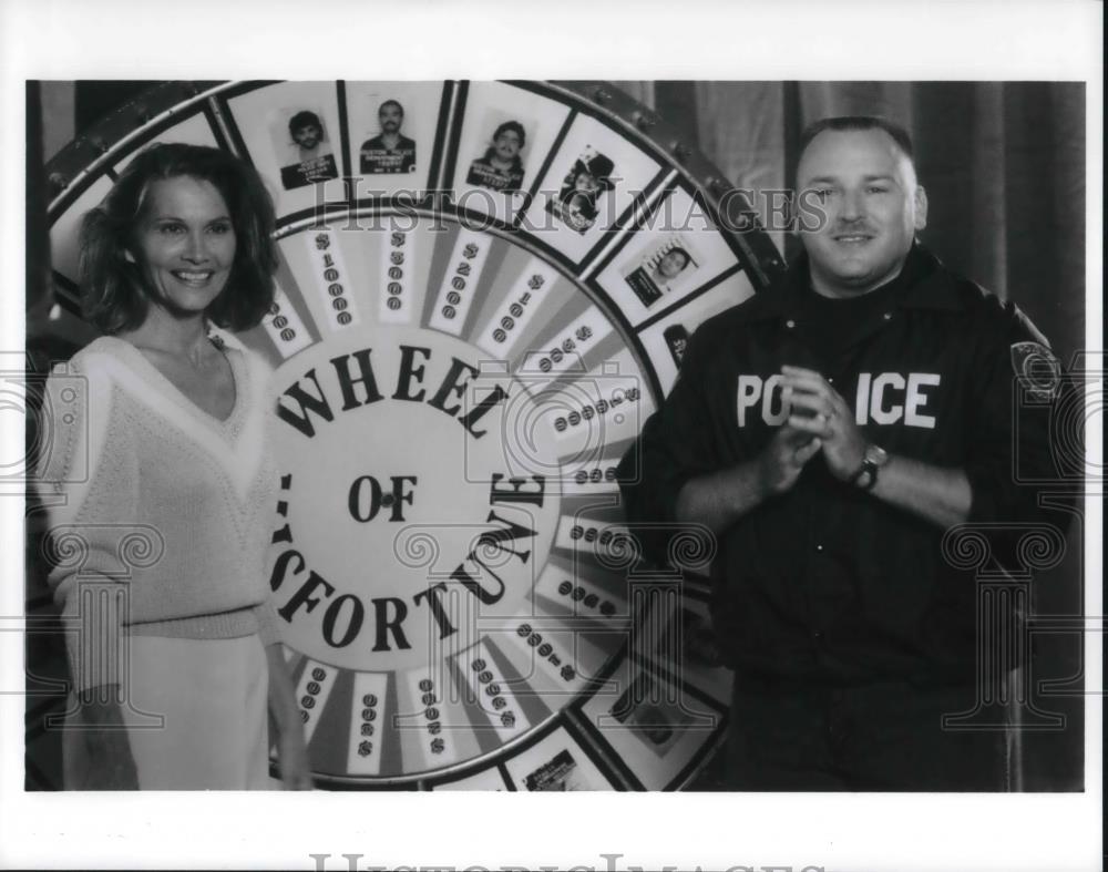 Press Photo Carol Merrill and Officer Ken Weiner on Wheel of Misfortune - Historic Images
