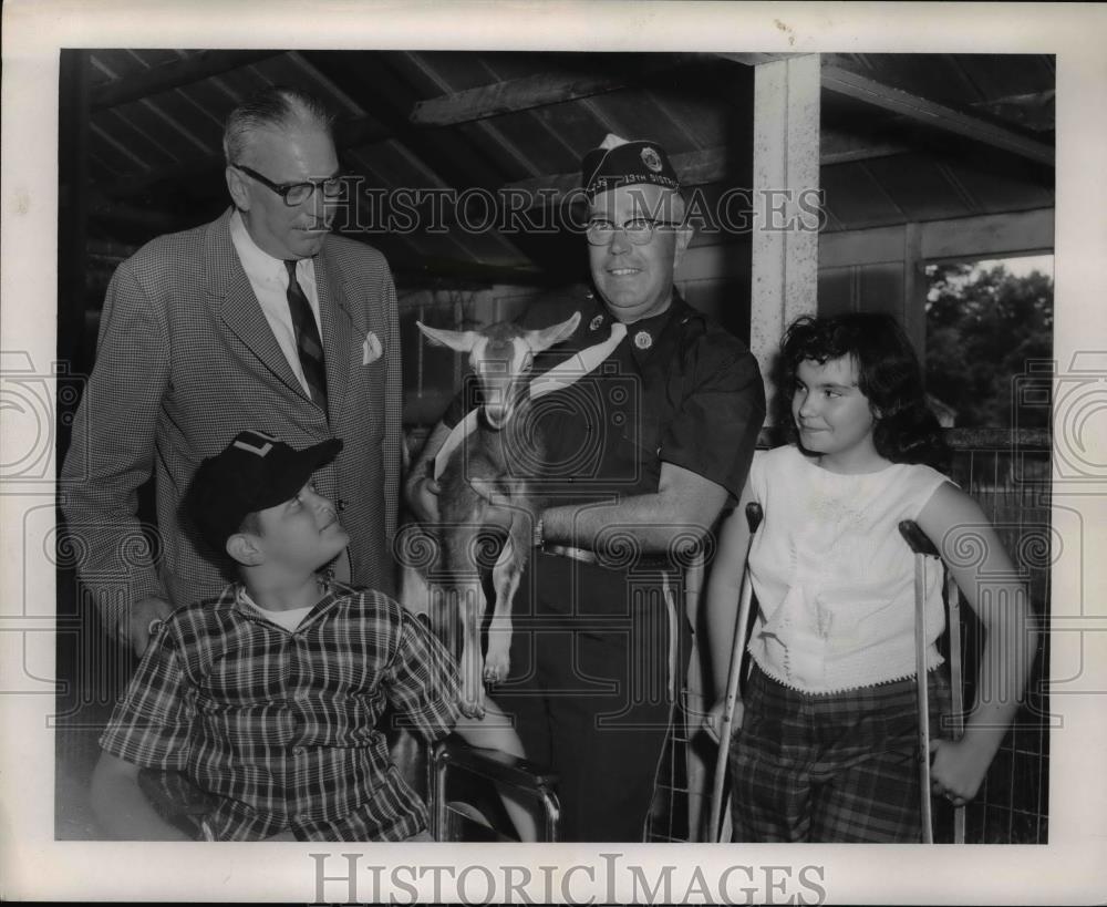 1959 Press Photo Camp Cheerful for Crippled Children Leader Holding Baby Goat - Historic Images