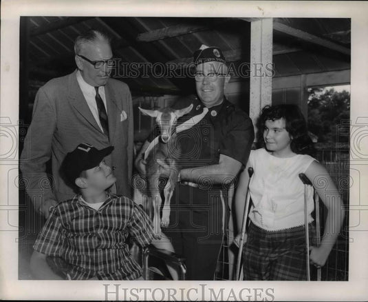 1959 Press Photo Camp Cheerful for Crippled Children Leader Holding Baby Goat - Historic Images