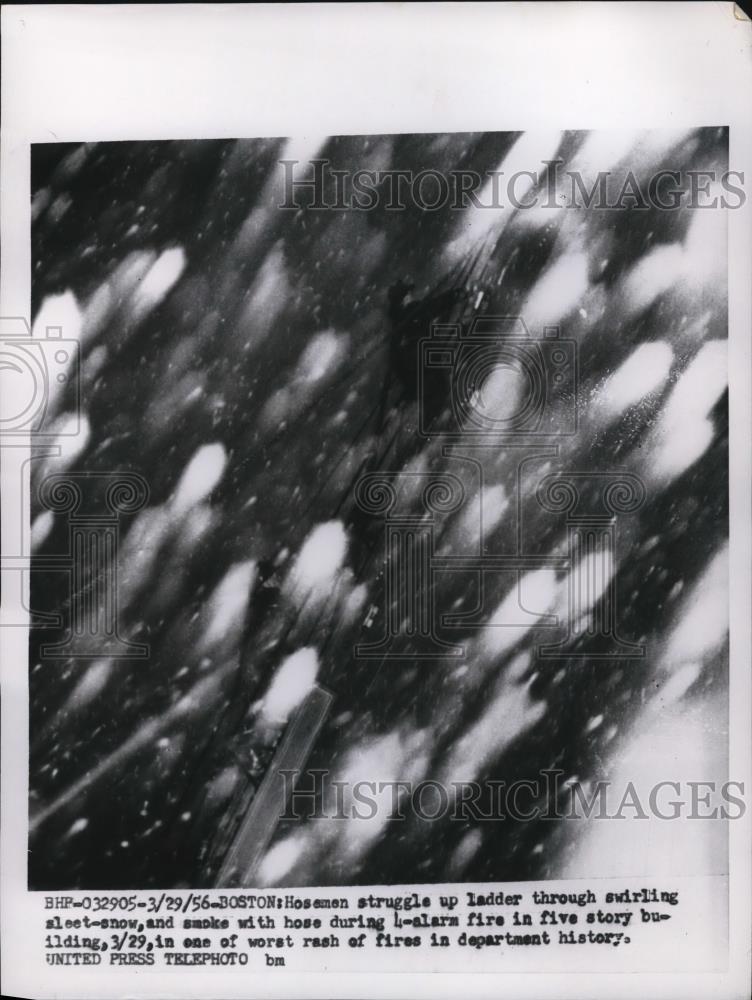 1956 Press Photo Snow and smoke at 4-alarm fire on burning building in Boston - Historic Images