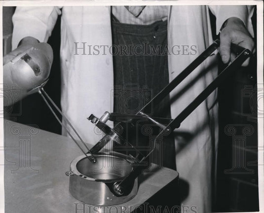 1949 Press Photo Tiny Radon Capsule picked up with long pair of tweezers - Historic Images