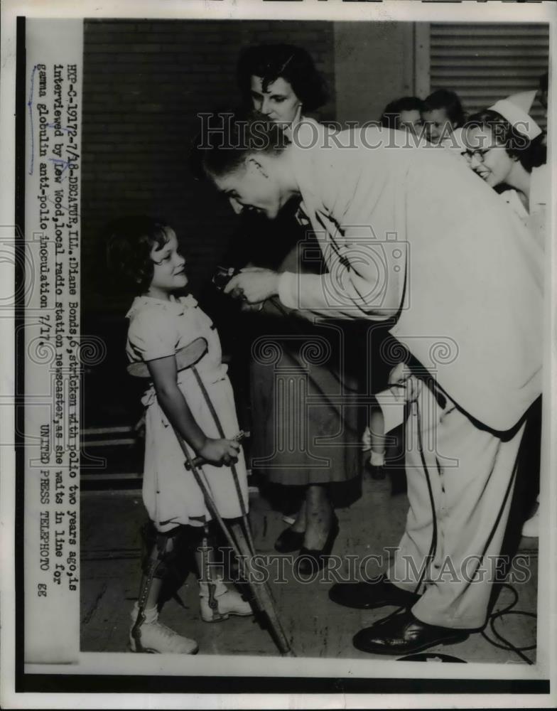 1953 Press Photo D. Bonds, with polio, interviewed by L. Wood, local radio host - Historic Images