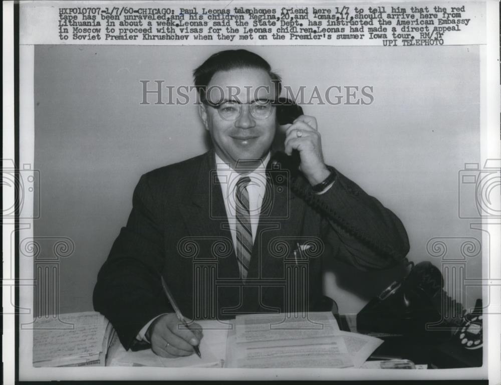 1960 Press Photo Paul Leonas calls friend on red tape unraveling - Historic Images