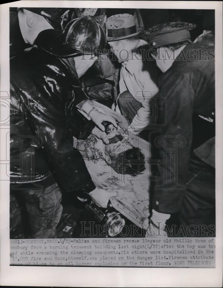 1951 Press Photo Police and Firemen rescue a ten year old Phillip Nunn - Historic Images