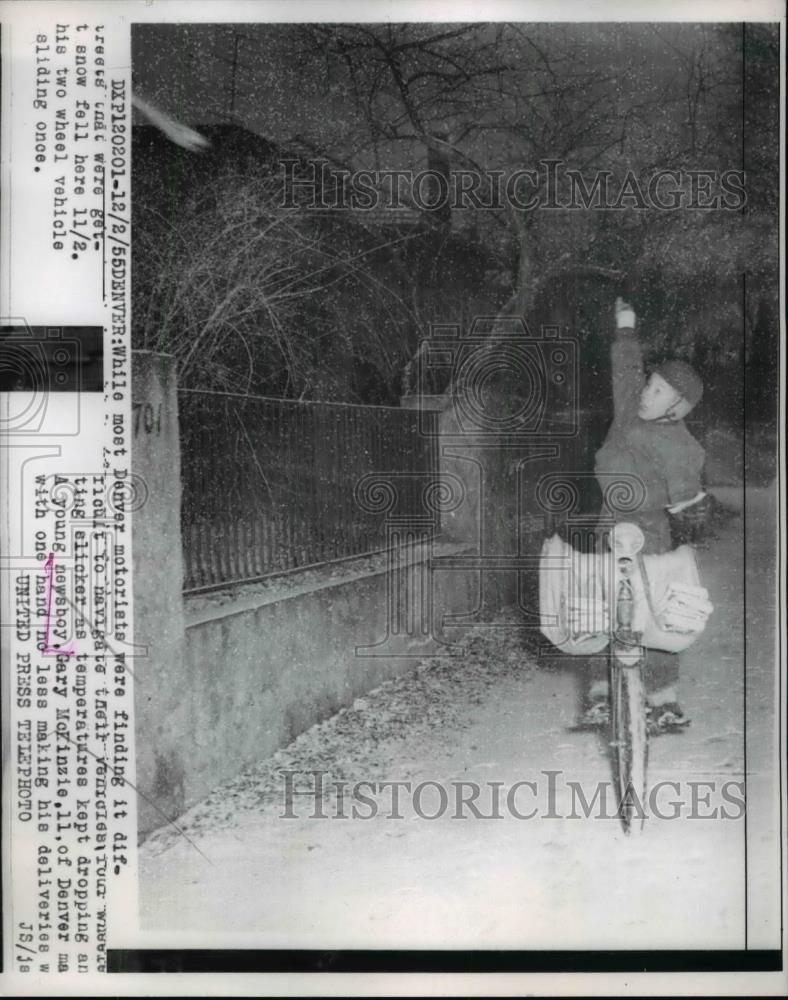 1955 Press Photo A young newsboy, Gary McKinzie works in a very cold waether - Historic Images