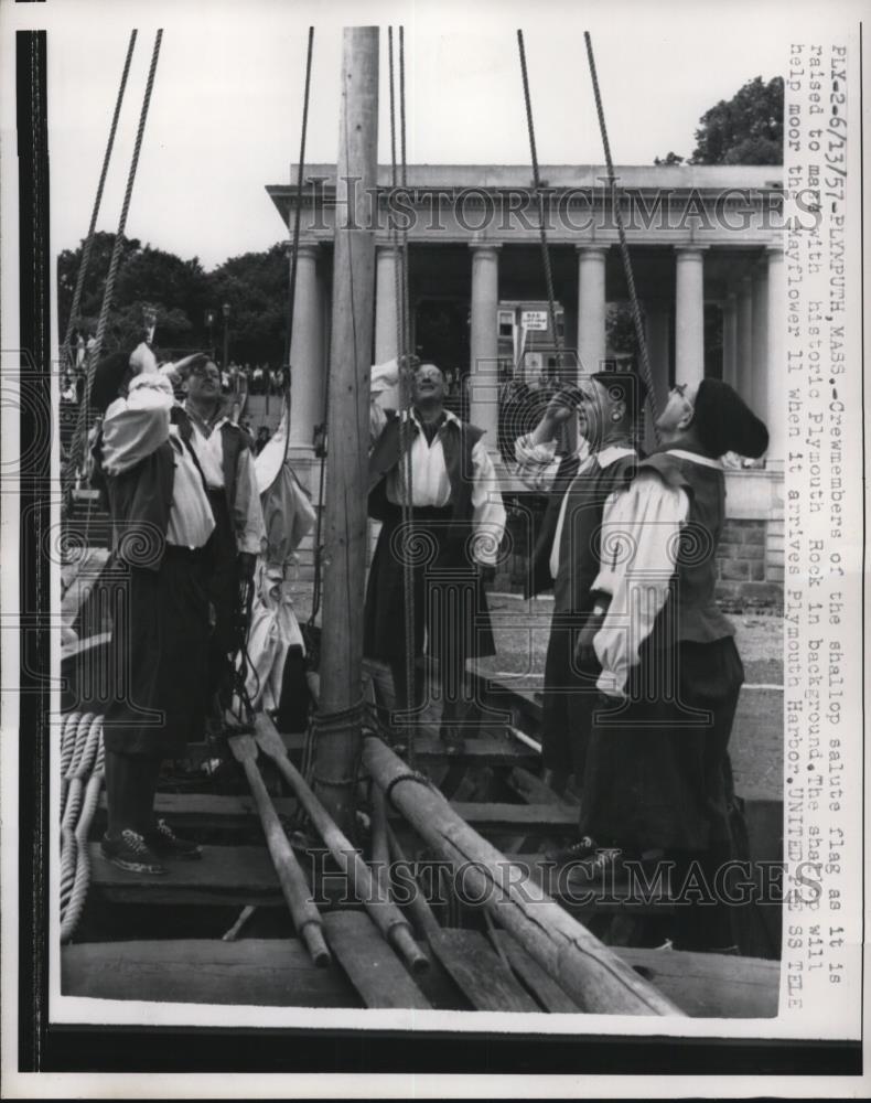 1957 Press Photo Crew member of the shallop salute Flag as it is raised to mass - Historic Images