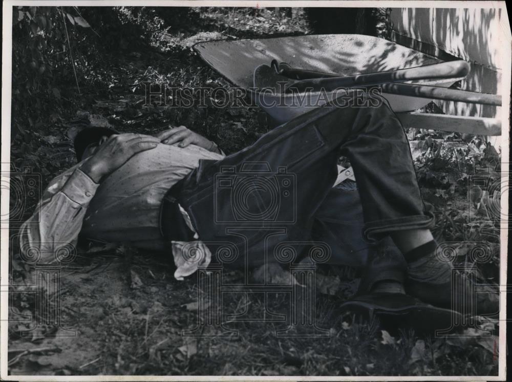 1954 Press Photo Man Sleeping on Ground Outdoors - Historic Images