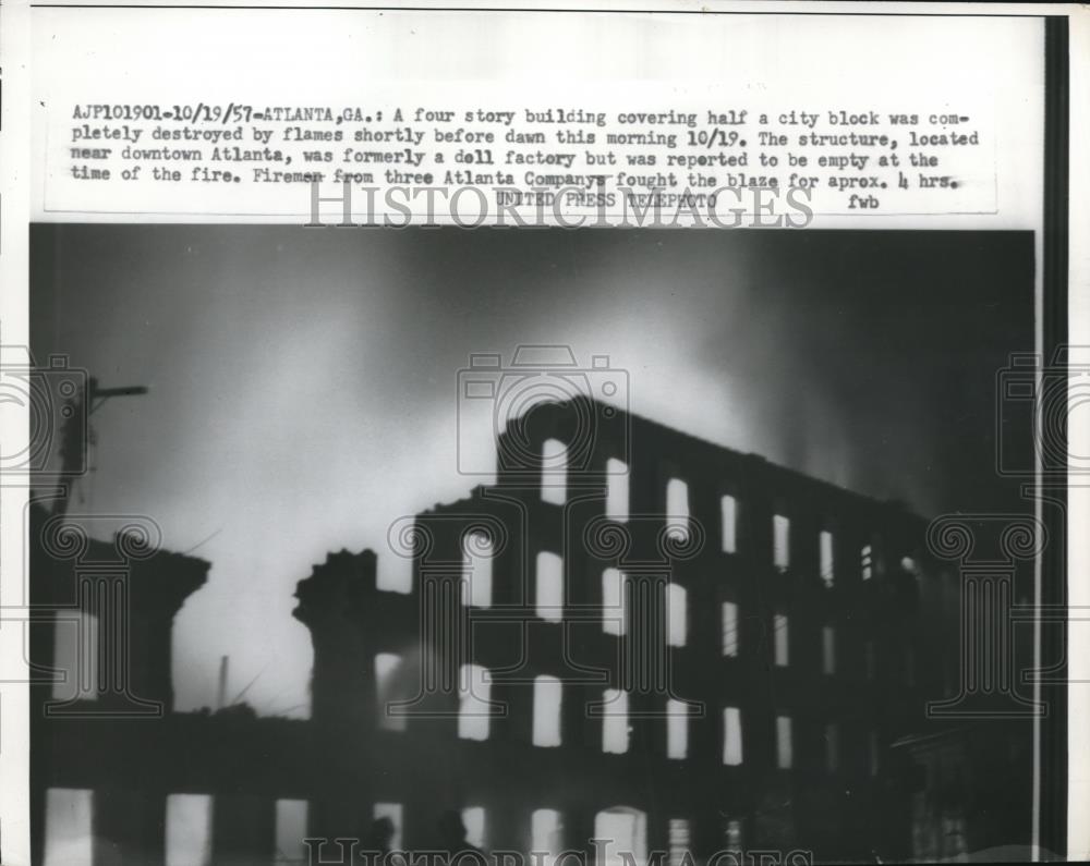 1957 Press Photo The half of the building completely destroyed by the fire - Historic Images