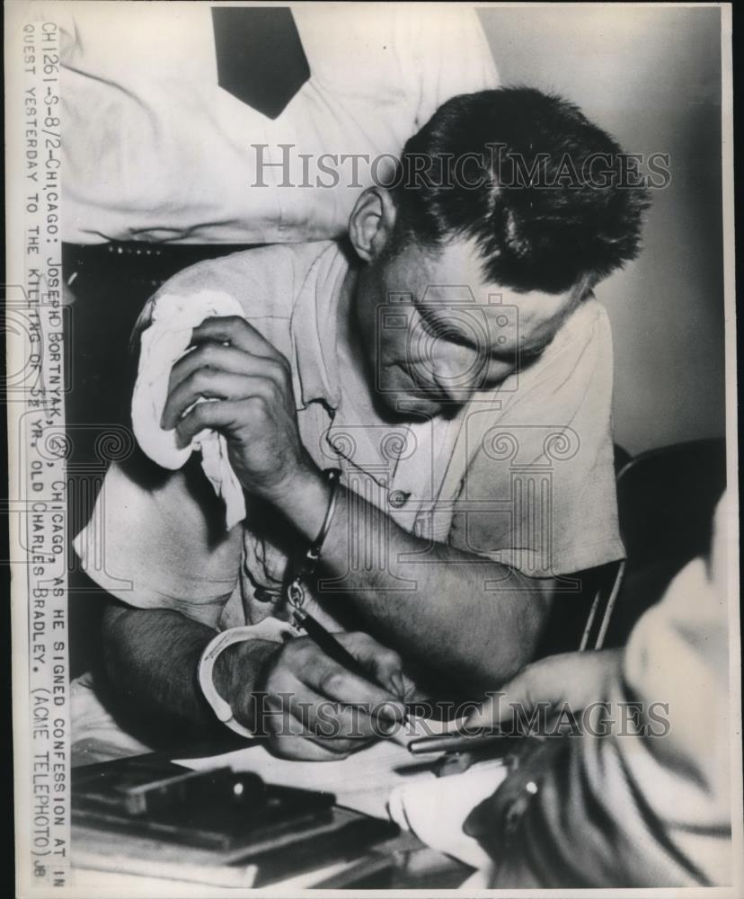 1947 Press Photo Joseph Bortnyak Signs Confession To Killing Charles Bradley - Historic Images